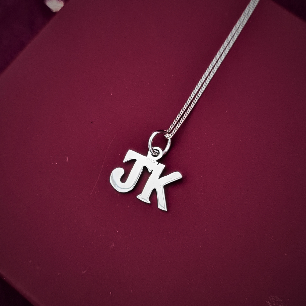 charm pendant in silver handmade with initials